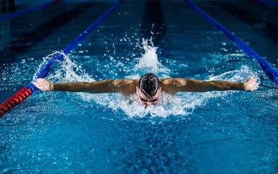 Swimmer practicing freestyle stroke in pool